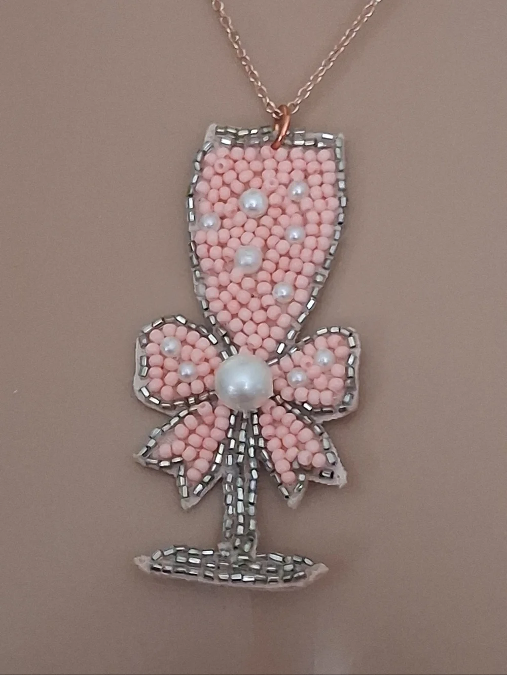 Pink Beaded Champagne Glass Pendant Necklace On A Rose Gold Chain.